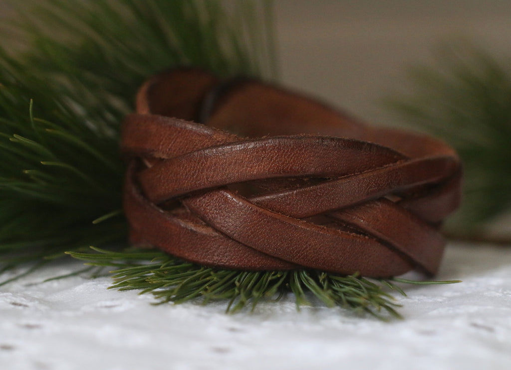 Brown leather bracelet on a grassy background